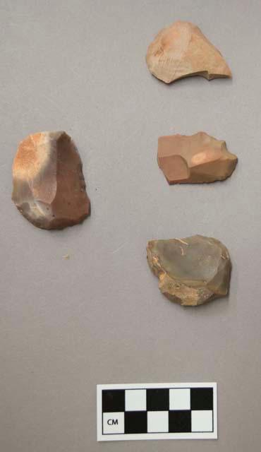 Flint scrapers, including grey, brown and purple colored stone, some contain cortex