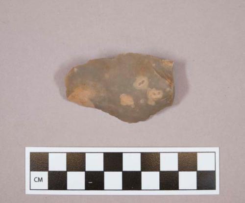 Flint flake; sidescraper; brown colored stone