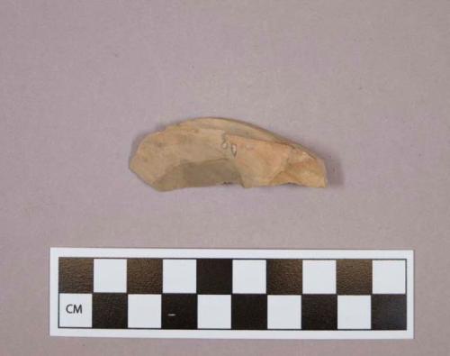 Flint blade; curved; tan-colored stone