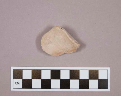 Flint endscraper; cream colored stone