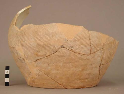 Large fragment of pottery urn - orange ware; pattern of cross hatching