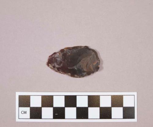 Flint sidescraper; brown colored stone