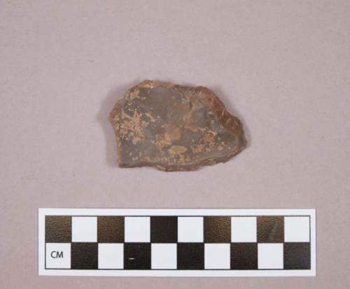 Flint sidescraper; brown colored stone