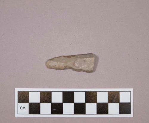 Flint denticulate blade; gray colored stone