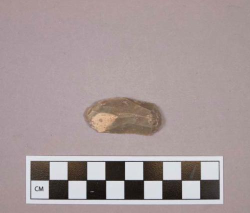 Flint endscraper on tan colored stone