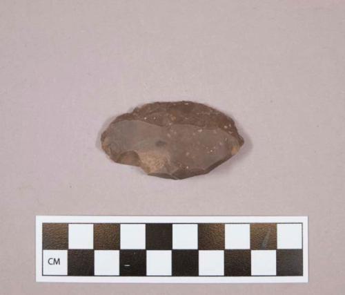 Flint sidescraper; brown colored stone