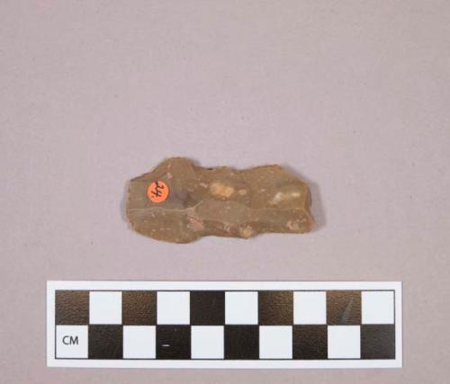 Flint blade; retouched; brown colored stone