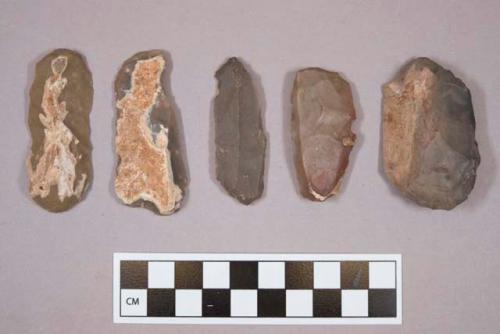 Flint scrapers, including tan, grey, brown and rust colored stone, some contain cortex