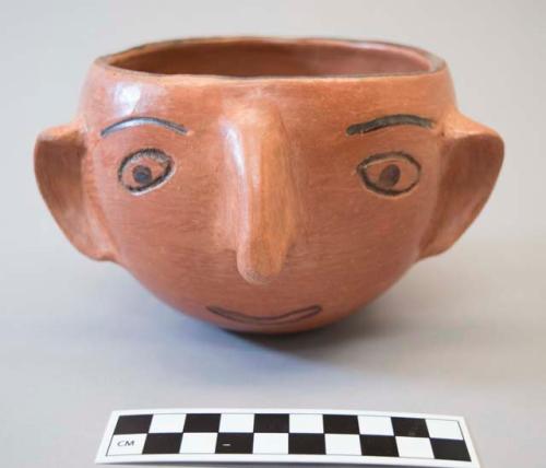 Black-on-red human face Bowl