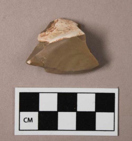 Flint flake, tan colored stone, contains cortex