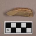 Flint flake, tan colored stone, contains cortex