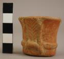 Miniature Red Ware vessel with appliqued and scarified motifs