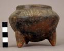 Small incised pottery tripod bowl