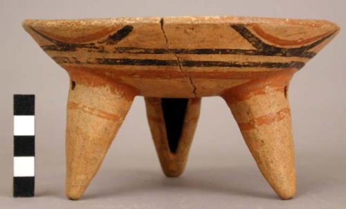 Restored polychrome pottery tripod bowl