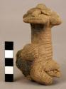 Marbella style zoomorphic decoration from tripod vessel leg.  "Mother and child"
