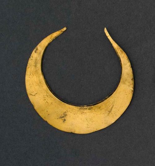 Gold crescent-shaped object