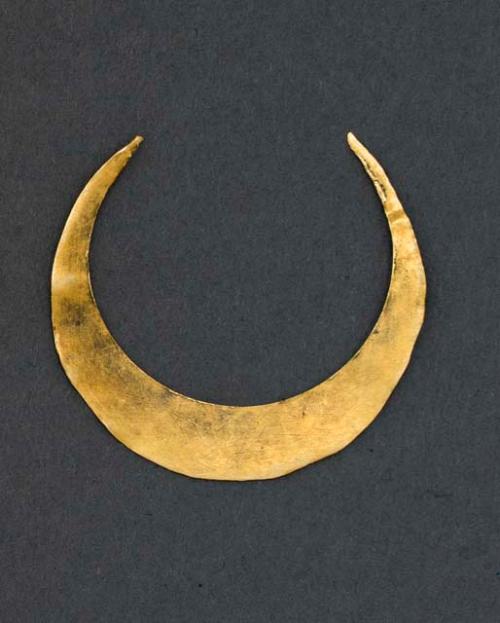 Gold crescent-shaped object