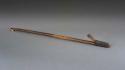 Wooden atlatl with one bone peg and one wooden peg