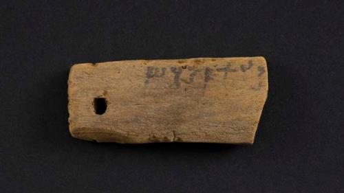 Small wooden fragment with tibetan on it