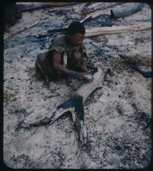 Man sitting and cracking mangettis