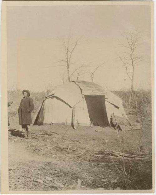 Covered Hut With Man To The Left