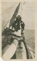 Arctic Voyage of Schooner Polar Bear - Eben S. Draper standing on canoes