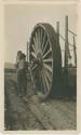 Arctic Voyage of Schooner Polar Bear - Man next to large wheel