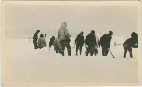 Arctic Voyage of Schooner Polar Bear - Crew cutting the ice