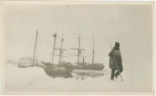 Arctic Voyage of Schooner Polar Bear - Man standing on the ice, schooners in background