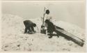 Arctic Voyage of Schooner Polar Bear - Three men next to canoe