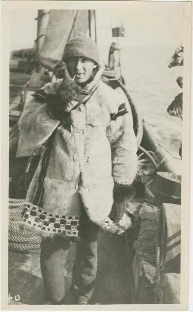 Arctic Voyage of Schooner Polar Bear - Man smoking pipe on deck