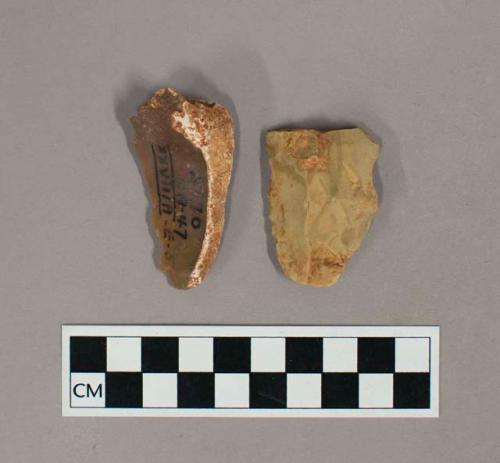 Flint flakes; one scraper with cortex; one notched on both sides; tan and brown colored stones