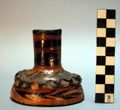 Candlestick, glazed and colored