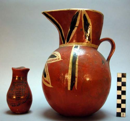 Toy pitchers, one large, pottery, red and black