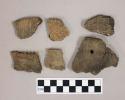 Ceramic, earthenware body and rim sherds with impressed exterior decoration and one sherd with a perforation.