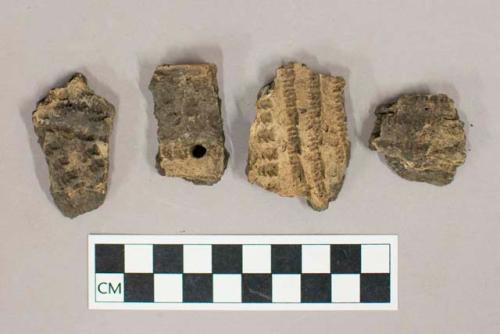 Ceramic, earthenware body and rim sherds with impressed exterior decoration, one with perforation