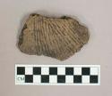 Ceramic, earthenware body sherd with impressed exterior decoration