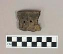 Ceramic, earthenware rim sherd with impressed and punctate exterior decoration