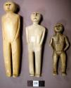 Dolls carved in ivory-male and female, incised