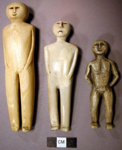 Dolls carved in ivory-male and female, incised