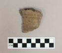 Ceramic, earthenware body sherd with impressed exterior decoration