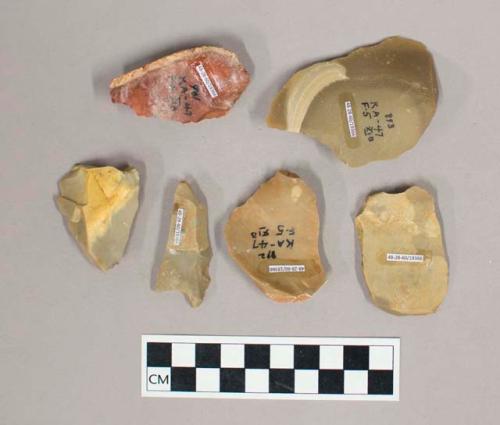 Flint flakes; some with cortex; tan, gray, and red colored stone