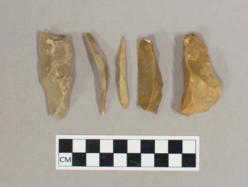 Flint flakes and blades; tan colored stone