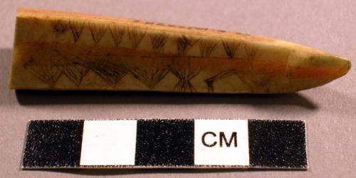 Decorated wedge of ivory - incised decoration