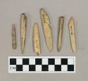 Worked bone points and harpoons, some with barbs or notches