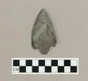 Chipped stone, corner-notched projectile point or biface, with ferrous staining at one corner