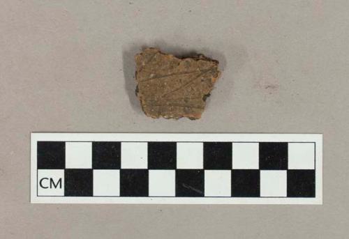 Ceramic, earthenware body sherd with incised exterior decoration