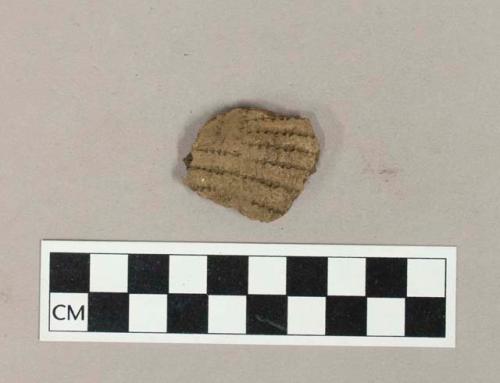 Ceramic, earthenware body sherd with impressed exterior decoration