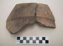 Ceramic, rim sherd of pot, incised and punctate designs on exterior, two sherds mended together
