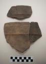 Rim sherds of pot, incised and punctate designs, both sherds mended